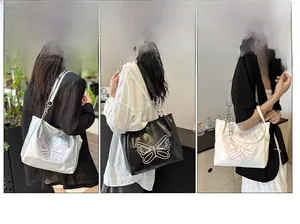 Three large tote bags in silver, black, and white with pink butterfly embroidery and chain strap