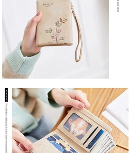 Detail view of the multi-slot interior and bird embroidery on the PU leather wallet