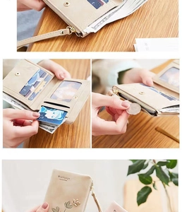 Detailed view of the multi-slot interior and bird embroidery on this beige PU leather wallet