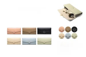 Detail of clover metal buckle and multi-card slot interior of this long wallet
