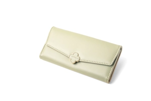 Close-up of pale green long wallet featuring a gold flower clasp and lychee texture