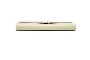 Detailed side view of slim pale green long wallet featuring circular gold metal buckle