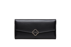 Close-up of black leather long wallet with gold clover clasp and fine stitching detail