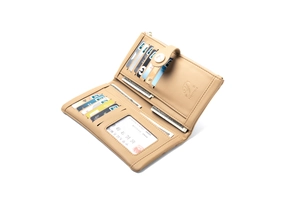 Detailed interior of a beige PU leather wallet with card slots and a zipper pocket