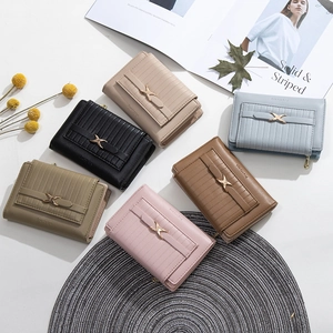 Short minimalist PU leather foldable wallet for women with elegant metal buckle decoration