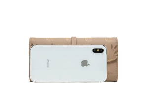 Detailed view of long printed leather wallet showing size comparison with a smartphone