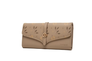 Close-up of the detailed leaf pattern and metal logo on the faux leather long wallet