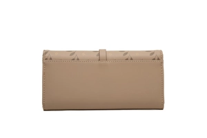 Close-up of a long leather wallet with leaf patterns and a secure buckle closure strap