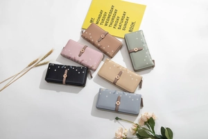 Flat lay of floral PU leather long wallets in six pastel colors with metal buckles