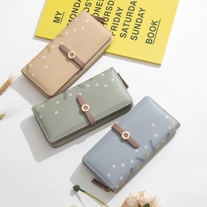 Long PU leather wallet for women with floral print, zip closure and buckle detail