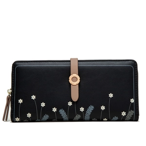 Close-up of floral print on black PU leather wallet with a golden metal buckle detail