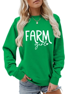 Detail of green Farm Girl crewneck sweatshirt showing ribbed collar and white slogan print