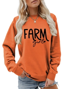 Detail of orange crewneck sweatshirt with black FARM girl print and ribbed cuffs
