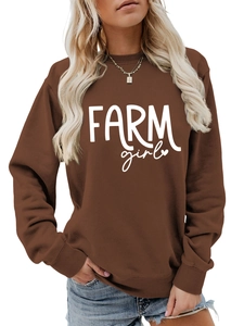 Detail of Farm Girl print and ribbed cuffs on a brown crewneck sweatshirt for women