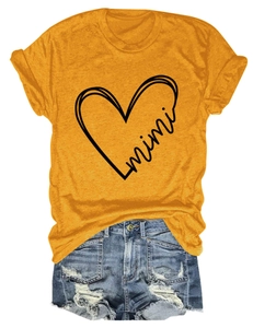Detail of yellow cotton blend T-shirt with mimi heart print and frayed denim shorts