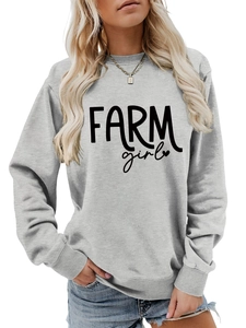 Detail of grey crewneck sweatshirt featuring black Farm Girl graphic and ribbed cuffs