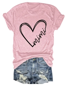 Flat lay of pink short sleeve T-shirt with mimi heart print and distressed denim shorts