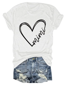 Detail of white cotton T-shirt with heart mimi print and distressed denim shorts set