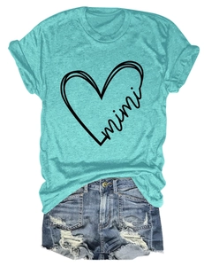 Flat lay of a teal t-shirt with mimi heart print paired with distressed denim shorts