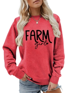 Close-up of Farm Girl graphic print on red long sleeve crewneck sweatshirt for women