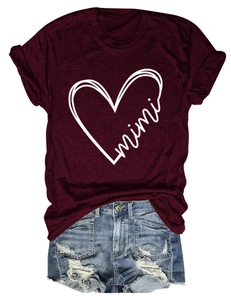Close-up of a burgundy round-neck T-shirt with mimi heart print and distressed denim shorts