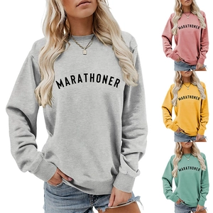 Collage of loose crewneck sweatshirts in grey, pink, yellow, and green colors