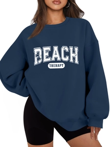 Detail of navy blue Beach Therapy sweatshirt with palm tree and bird graphic print