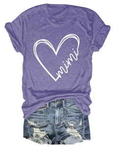 Flat lay of purple mimi heart print t-shirt with distressed denim shorts