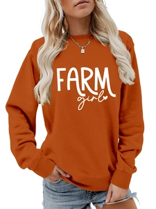 Detail of Farm Girl script print and ribbed crew neck on burnt orange sweatshirt