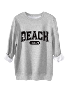Detail of the thick white fleece lining on the cuff of a grey Beach Therapy sweatshirt