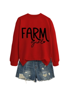 Close-up of Farm Girl print on red sweatshirt paired with frayed denim shorts