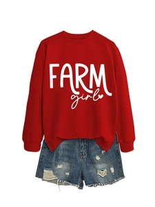 Detail of red crewneck sweatshirt with white Farm Girl print and distressed denim shorts