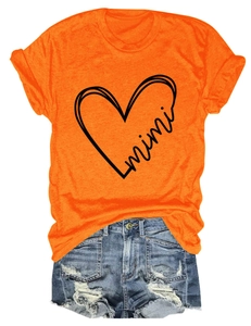 Flat lay of an orange cotton T-shirt with mimi heart print and ripped denim shorts set