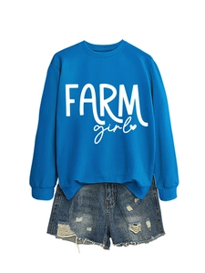 Flat lay detail of blue crewneck sweatshirt with white Farm Girl print and denim shorts