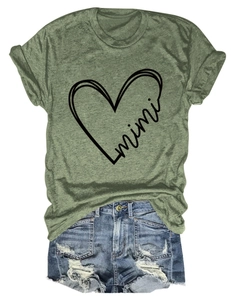 Detailed flat lay of green mimi heart t-shirt with distressed denim shorts