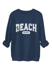 Detailed close-up of navy blue sweatshirt with Beach Therapy white collegiate lettering