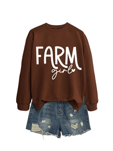 Detailed flat lay of brown farm girl sweatshirt with ripped blue denim shorts