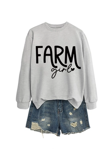 Detail of grey crewneck sweatshirt with FARM girl print and distressed denim shorts
