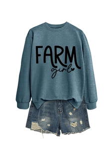 Detailed shot of Morandi blue Farm Girl sweatshirt with frayed denim shorts