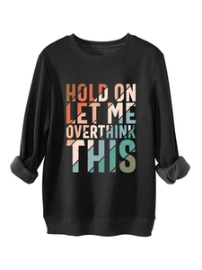 Detail of sweatshirt cuffs showing thick fleece lining and printed slogans text art