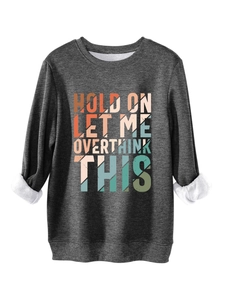 Detail of warm fleece lining and colorful Overthink graphic on dark grey sweatshirt