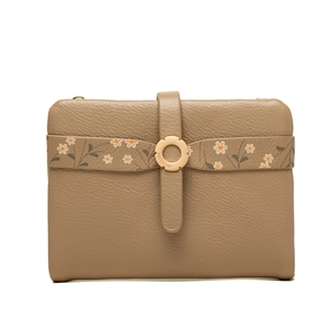 Close-up of khaki pebbled leather wallet featuring floral strap and golden metal buckle