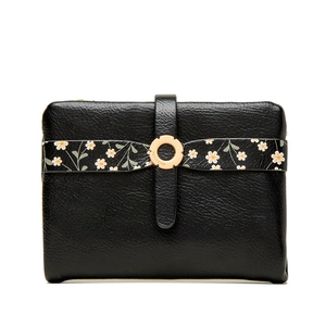 Close-up of black leather wallet with floral strap and gold logo metal buckle