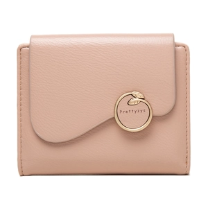 Detail of a pink short fold wallet featuring pebble leather and a gold round buckle