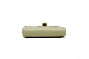 Detail view of the mint green PU leather wallet showing textured finish and metal clasp