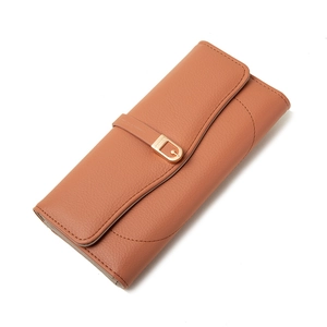 Minimalist long leather wallet for women in tan with golden horseshoe buckle and flap