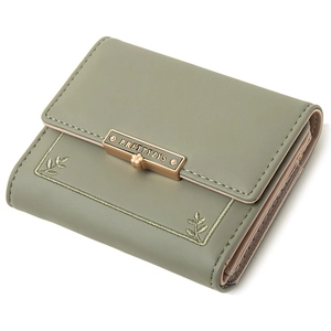 Close-up of bean green PU leather wallet with embroidered leaf design and metal buckle