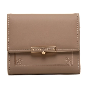 Detail view of tri-fold PU leather wallet with grey embroidery and floral gold buckle