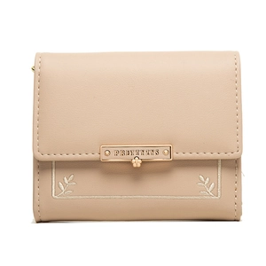 Close-up of apricot PU leather wallet with elegant leaf embroidery and gold floral clasp