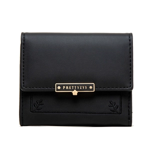 Close-up of black PU leather wallet with golden logo plate and leaf embroidery